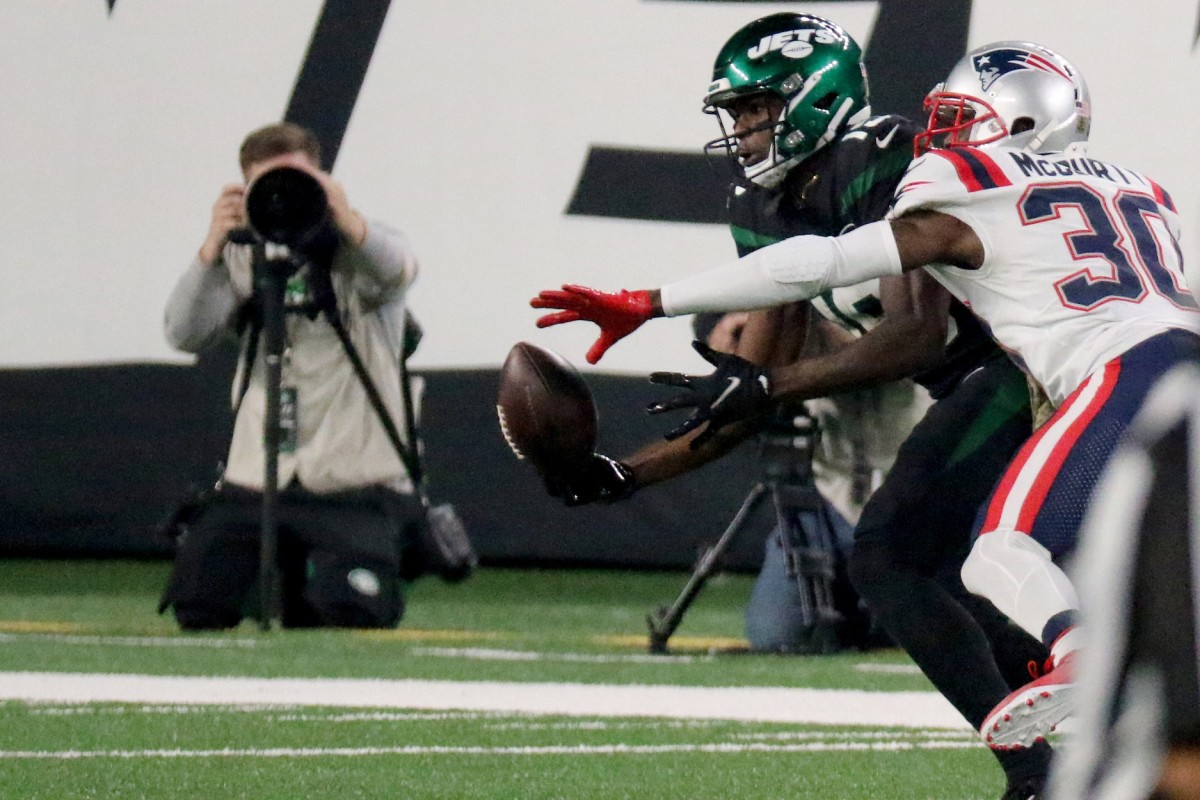 Nov 9, 2020; Jets receiver Breshad Perriman (19) tries to make a catch as Patriots cornerback Jason McCourty (30) defends. Mandatory Credit: Kevin R. Wexler/NorthJersey.com via USA TODAY